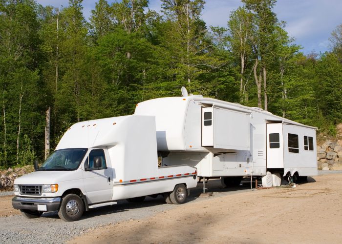 Fifth wheel trailer parked at a campground
